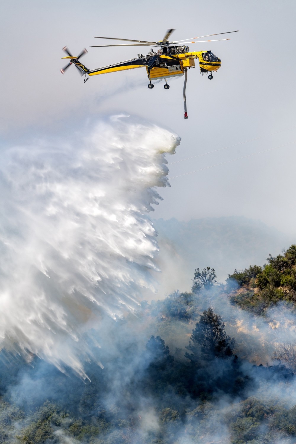 Helicopters Express’s Skycrane drops water at the Post Fire near Gorman, California. I looked at Flightradar24 to see where the helicopters were dropping and found a dirt road that got me to the perfect location.