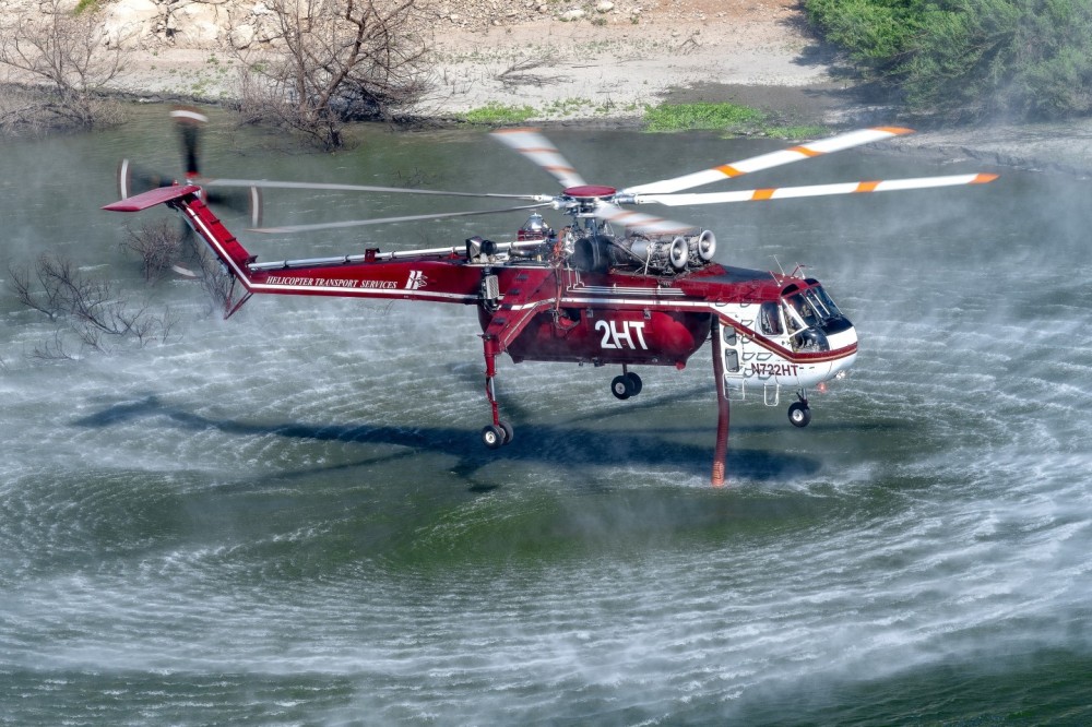 I looked on Flightradar24 to see where the helicopters were picking up water for the Bridge Fire in Azusa Canyon, California, and saw it was Morris Dam. After driving for about two hours, I positioned myself as close as I could, to get the best angle of Helicopter Transport Services’ Skycrane picking up water. The temperature was 110°F and it really made it more difficult for the fire fighters to work.