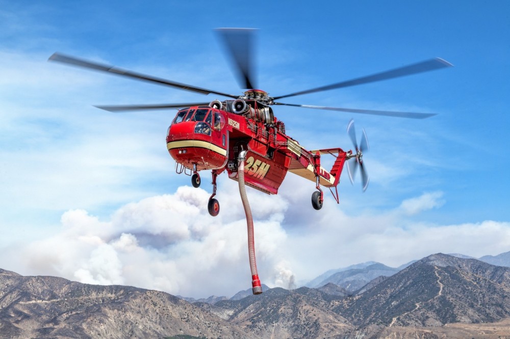 I saw that a few of the helicopters fighting the Line Fire in Highland, California were based at Redlands Municipal Airport.  I got permission to go out on the flightline and did a variety of pictures. When Siller’s Skycrane came in after dropping retardant on the Line Fire, I positioned myself so I could get the smoke from the fire in the background. Being so close to these beautiful and powerful helicopters, is an awesome experience. This picture was taken at 75mm.