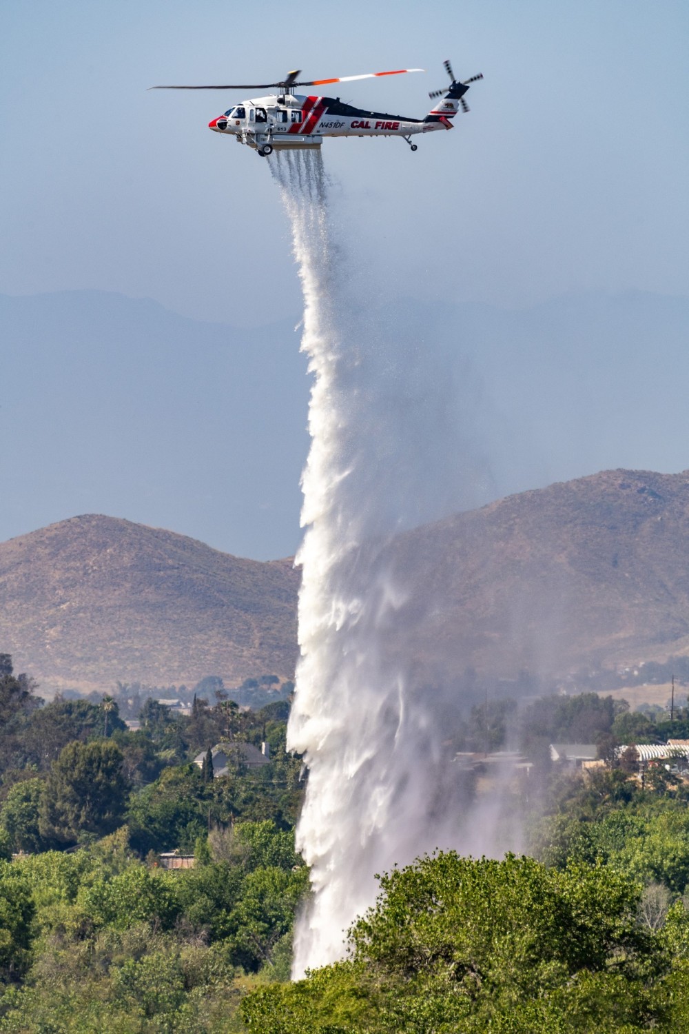 Cal Fire’s Firehawk 613 does a high drop on the Limonite Fire in Jurupa Valley, California. I was unfortunately delayed from getting into the fire, but was able to photograph various helicopters putting out the remaining spot fires.