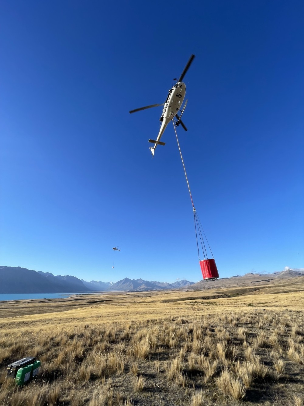 Heliventures AS350 B3+ ZK-HEN coming in for fuel while fighting Tussock fire in Tekapo, New Zealand. Photo taken by Brock Lory. Southern Lakes B3 also in the background coming in for fuel.