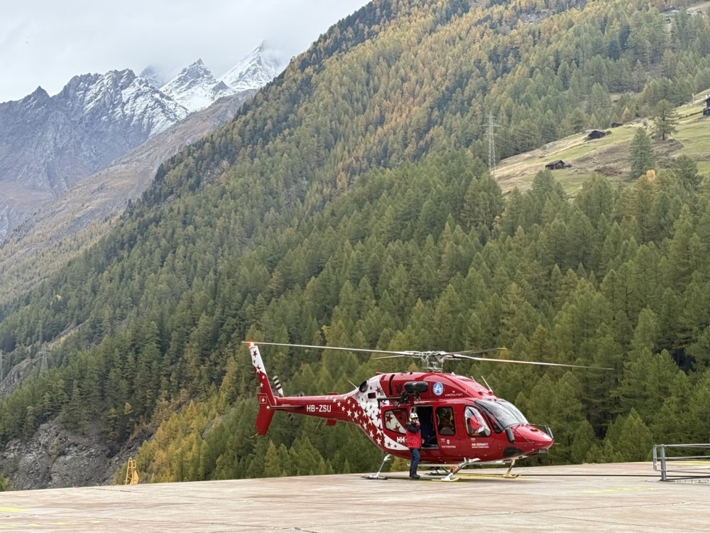 Air Zermatt Bell 429 returning to heliport Zermatt after hoist training in the Swiss alps. The bell 429 is a multipurpose aircraft from air medical missions to long line work and construction.