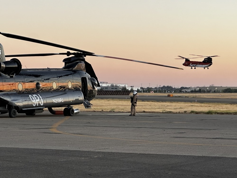 9PJ preparing for take off. The acft and crew where  heading out to drop water on the Crozier fire in Aug 2024. The flight occured at night on NVG's. The aircraft in the air belong to Heli Max and they were performing in flight operational checks. Photo was taken just before sun down.